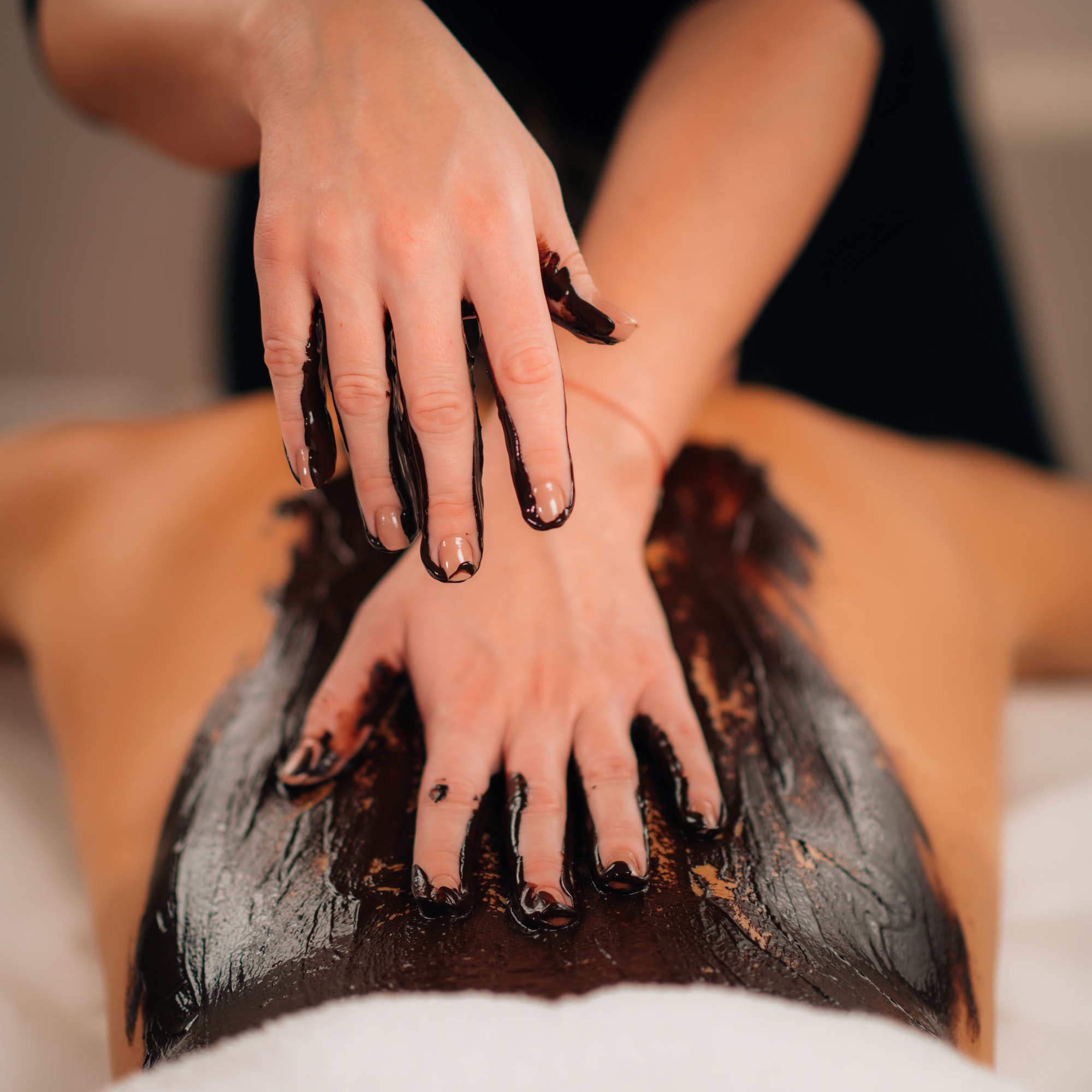 chocolate body massage beauty treatment with rich cocoa paste